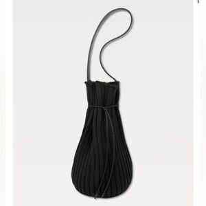 Hoi Bo Exhale Supernova knit drawstring leather trim black bag made in Canada